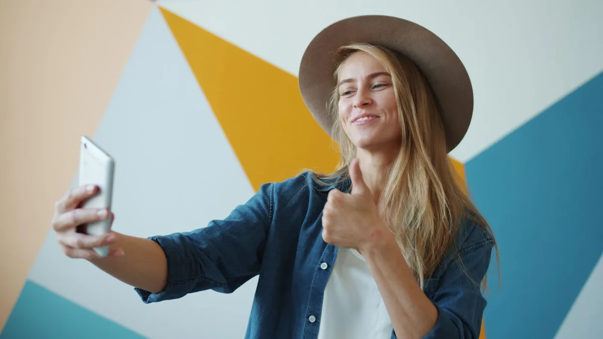 Couple celebrating good news on a laptop after a same day loan decision