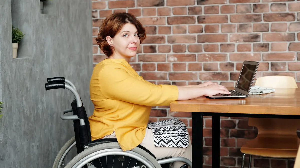 Calm person reviewing disability loans repayment dates on documents at home